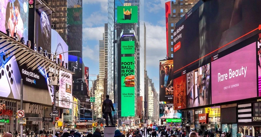 Bright digital billboards overlooking the pedestrian plaza in Times Square, New York
